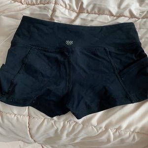 Two active wear shorts in colors black and gray